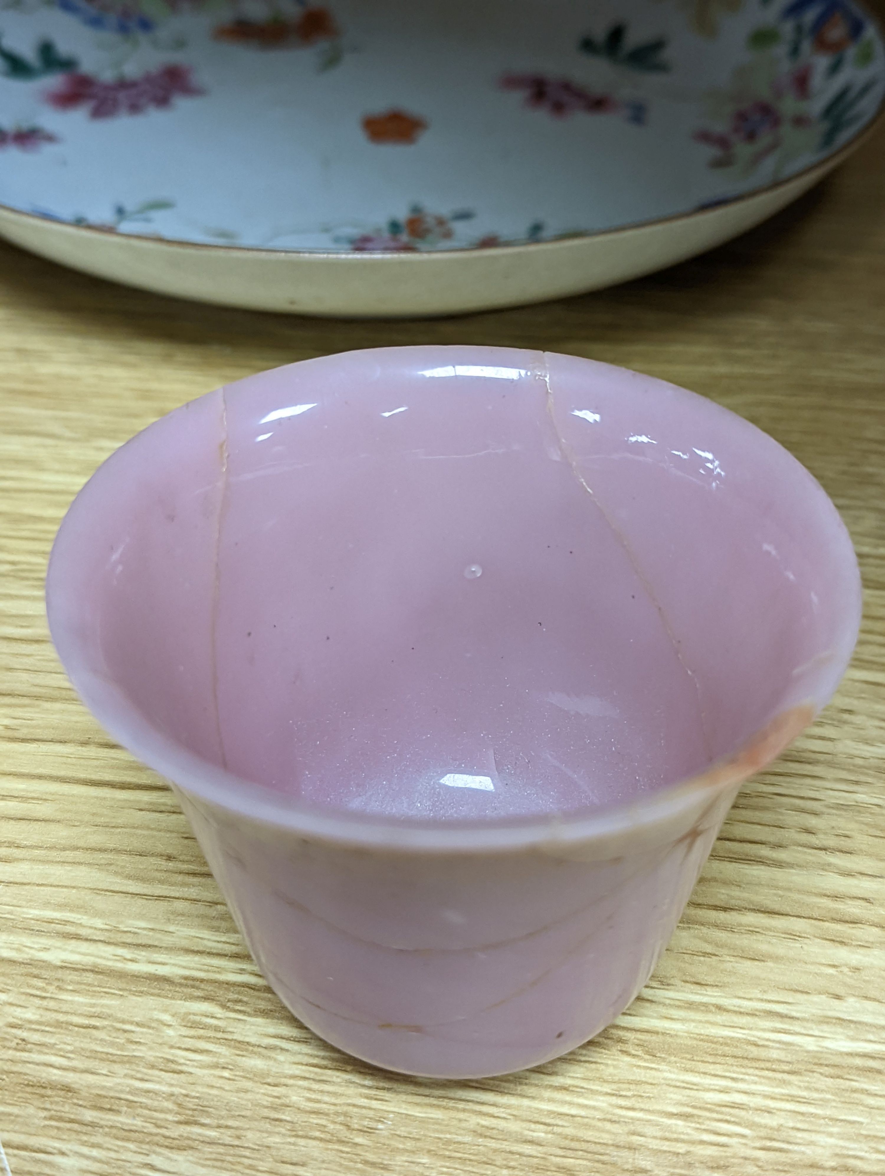 An 18th century Chinese famille rose dish, crackle-glaze stem cup, Beijing glass tea bowl and a Chinese Imari plate. Largest 24cm